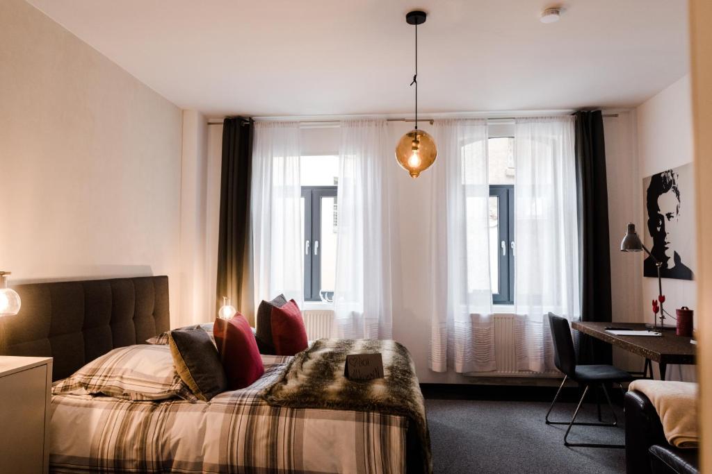 Postel nebo postele na pokoji v ubytování Sommers Hotel Altes Posteck