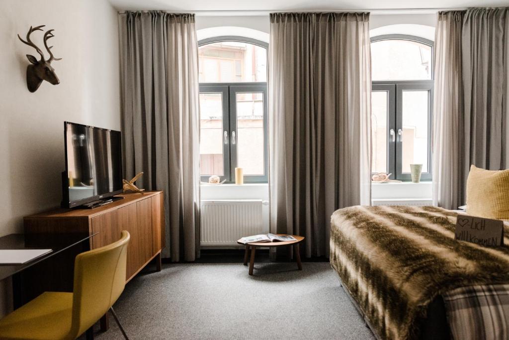 Postel nebo postele na pokoji v ubytování Sommers Hotel Altes Posteck