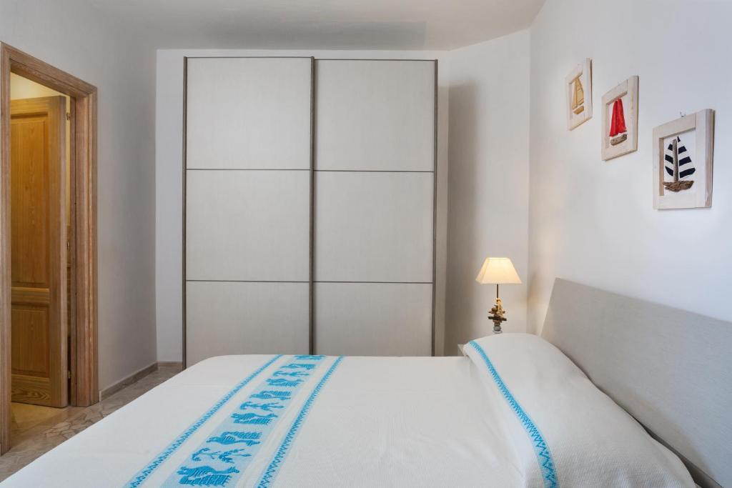 Postel nebo postele na pokoji v ubytování Le Maree Apartments