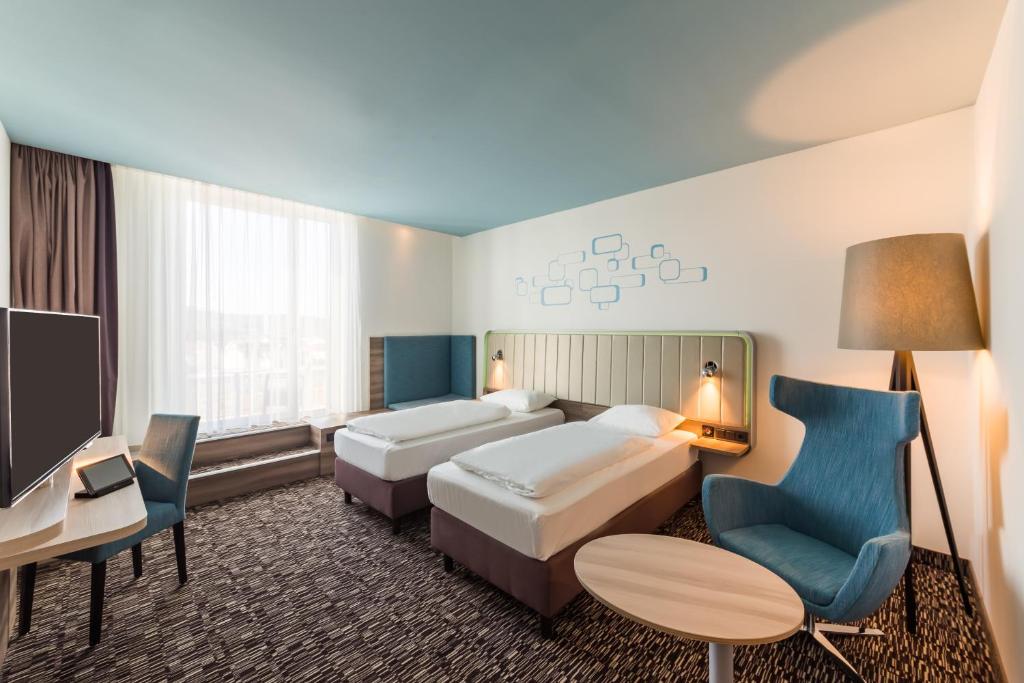 Postel nebo postele na pokoji v ubytování Park Inn by Radisson Neumarkt