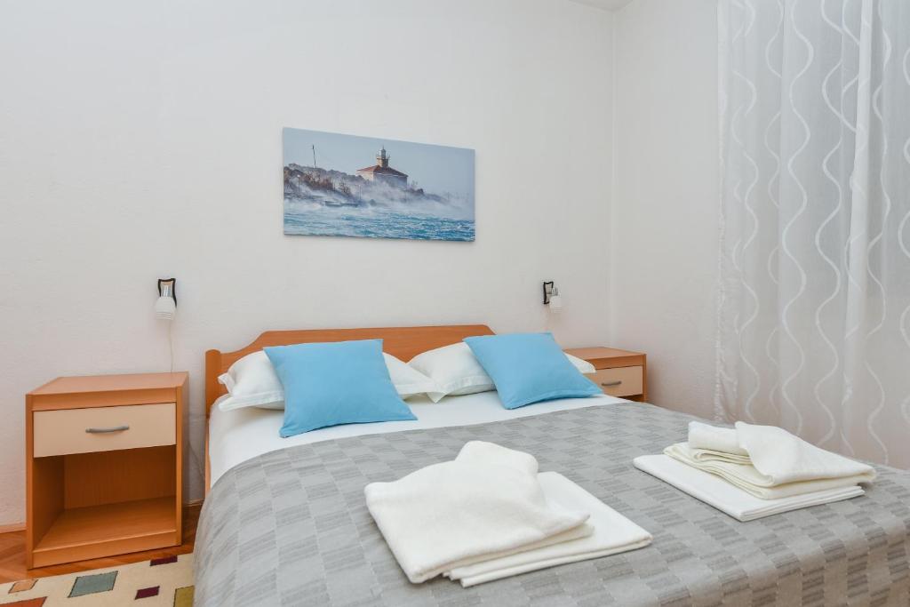 Posteľ alebo postele v izbe v ubytovaní Apartman Moga Dida