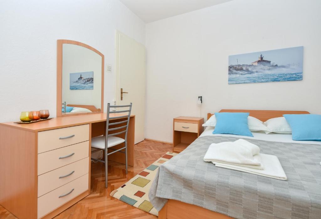 Posteľ alebo postele v izbe v ubytovaní Apartman Moga Dida