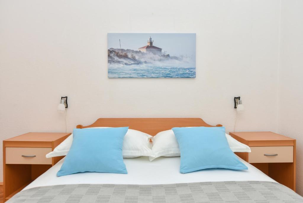Posteľ alebo postele v izbe v ubytovaní Apartman Moga Dida
