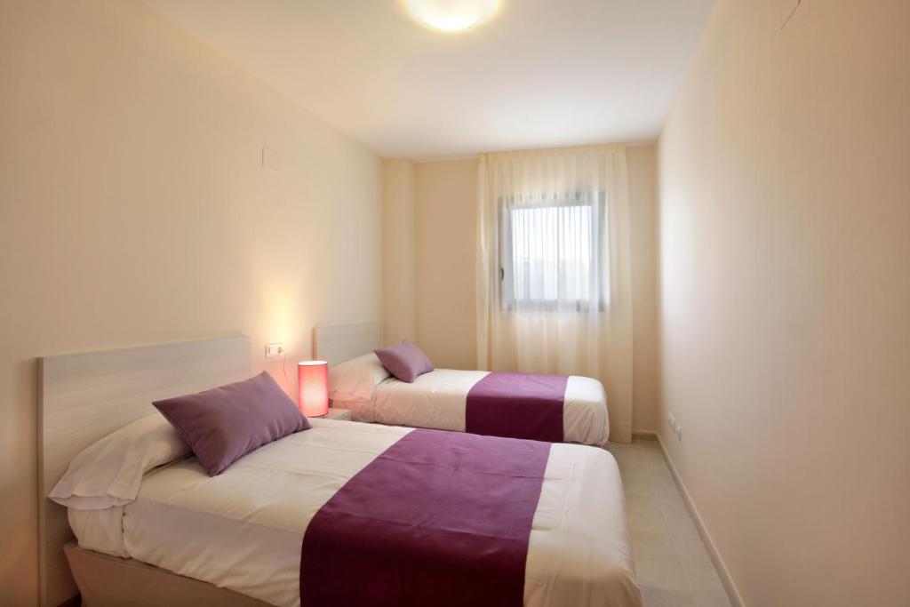 Postel nebo postele na pokoji v ubytování Pierre & Vacances Salou