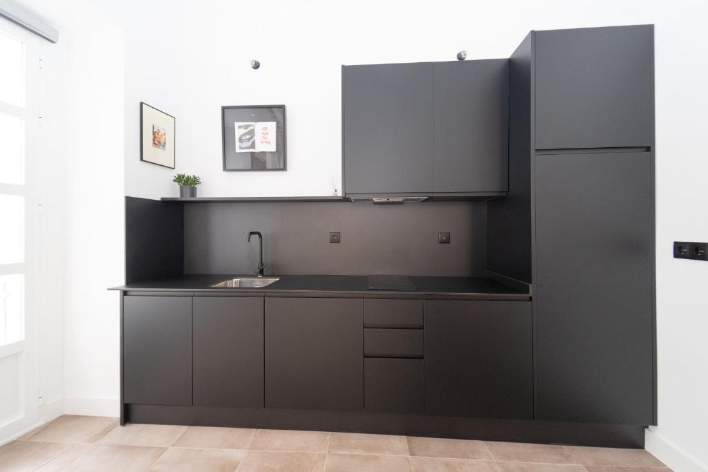 A kitchen or kitchenette at Casa Miguel - Apartamento 6