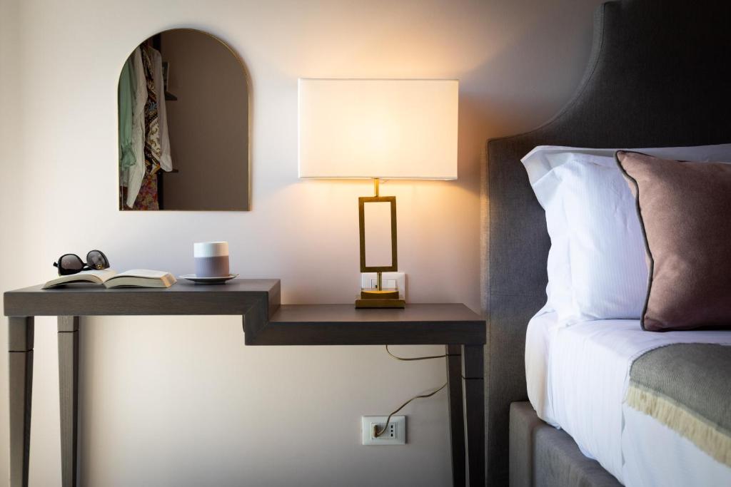 Postel nebo postele na pokoji v ubytování Villa Masetta - Luxury Suites