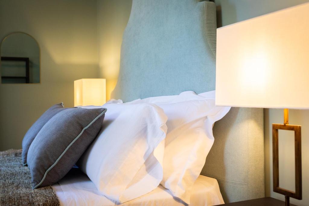 Postel nebo postele na pokoji v ubytování Villa Masetta - Luxury Suites