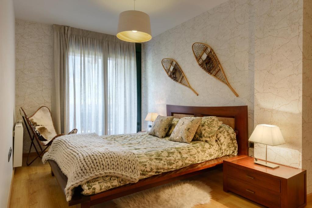 Postel nebo postele na pokoji v ubytování Peña Sabocos II Apartamento Turístico Panticosa