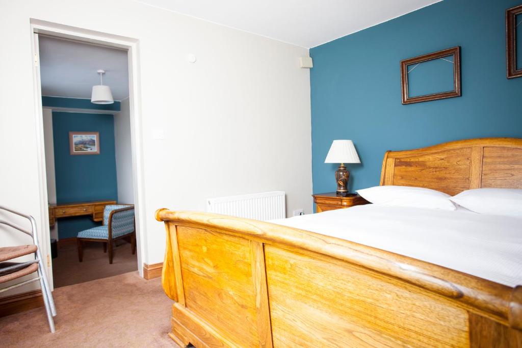 Postel nebo postele na pokoji v ubytování Fort Conan Hotel