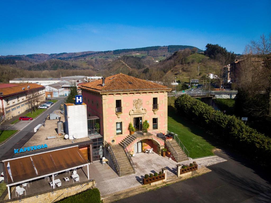 an aerial view of a building in a city at Hotel Palacio Atxega in Usúrbil