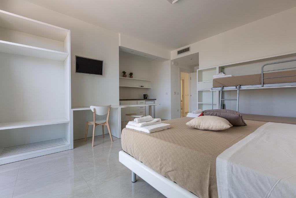 Postel nebo postele na pokoji v ubytování Stella del Mare Residence