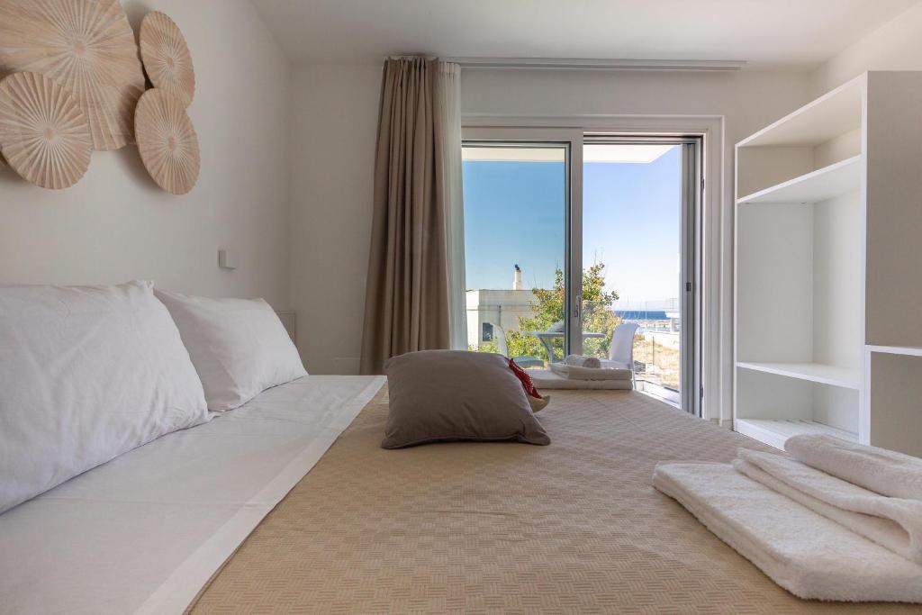 Postel nebo postele na pokoji v ubytování Stella del Mare Residence