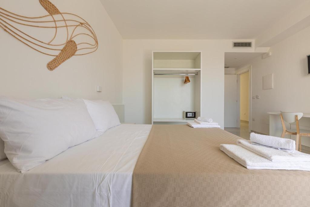 Postel nebo postele na pokoji v ubytování Stella del Mare Residence