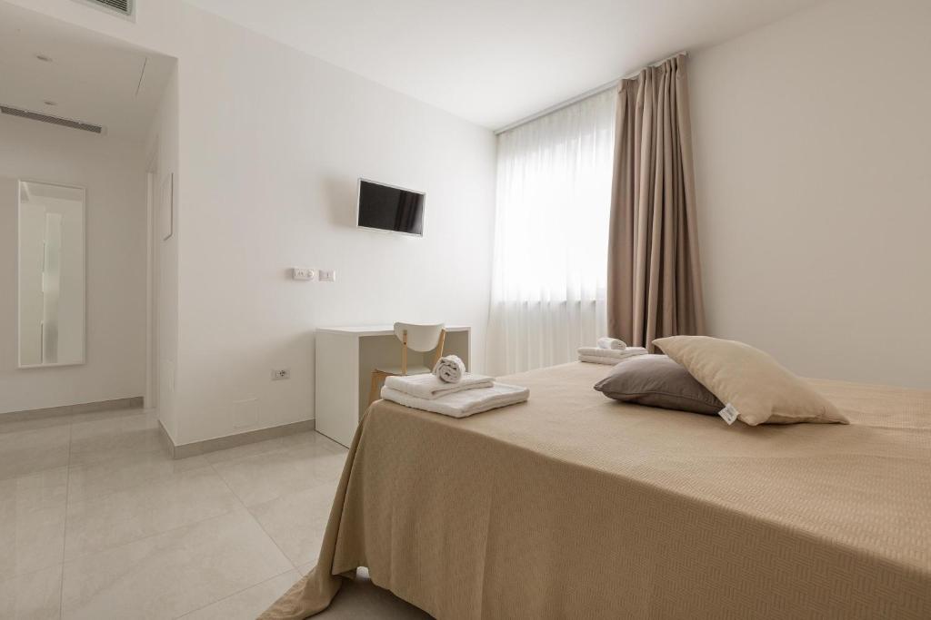 Postel nebo postele na pokoji v ubytování Stella del Mare Residence