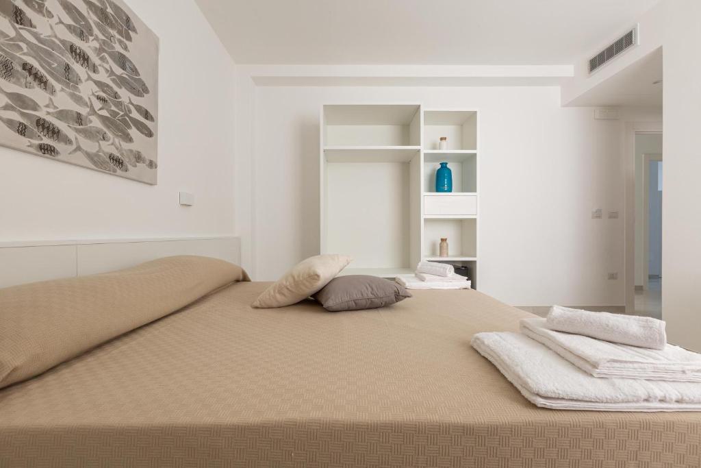 Postel nebo postele na pokoji v ubytování Stella del Mare Residence