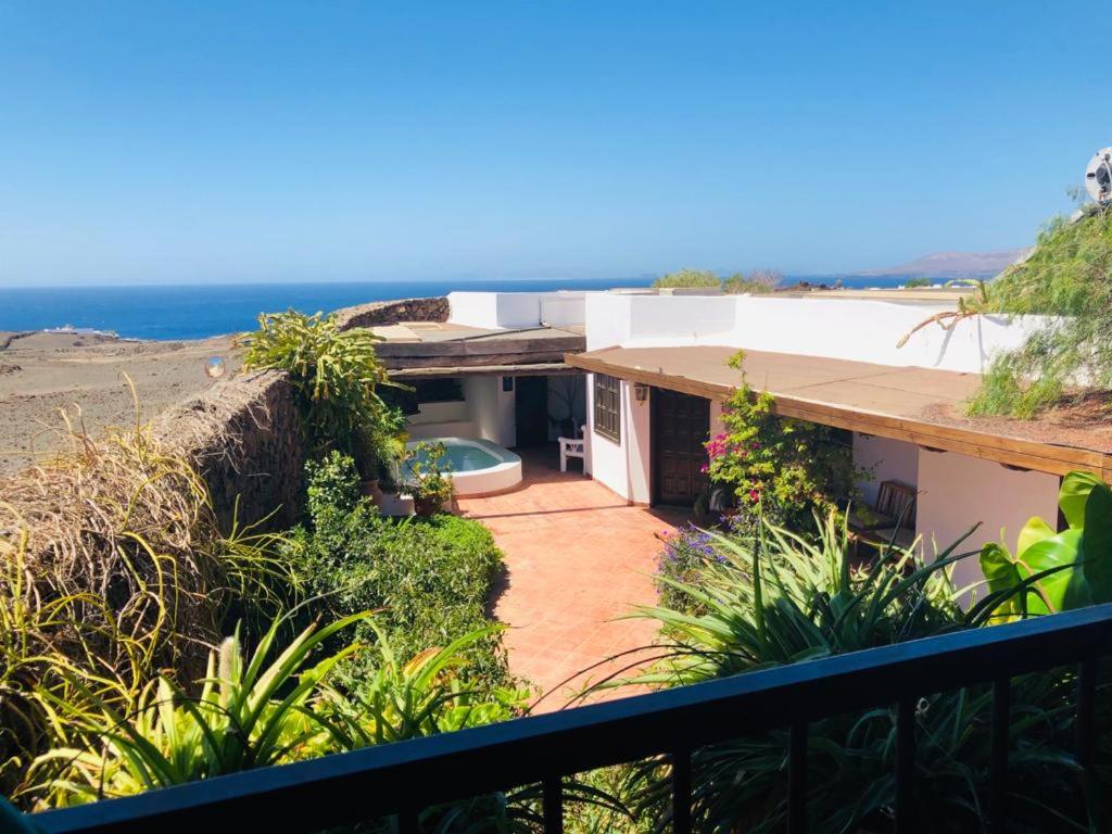 a view of a house with the ocean in the background at Beautiful 3-Bed vacation House in Macher in Mácher