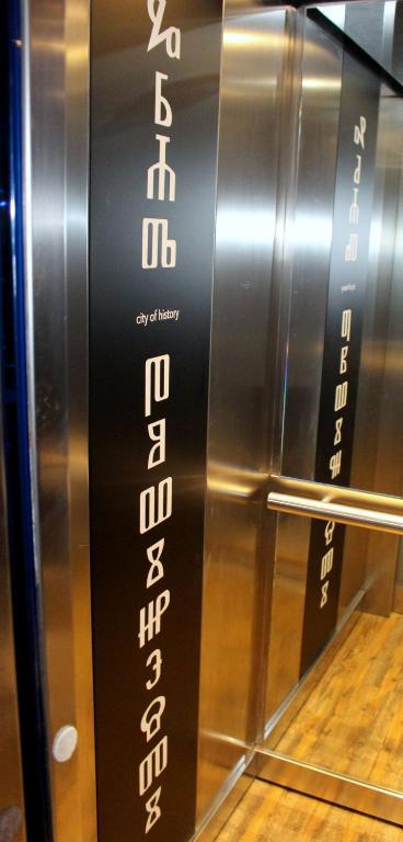 a elevator with a black and white sign on it at Boutique Hotel Bura 45N in Senj