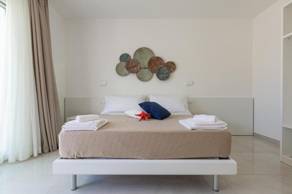 Postel nebo postele na pokoji v ubytování Stella del Mare Residence