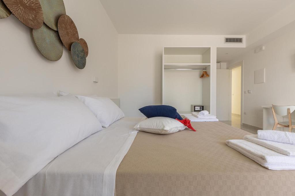 Postel nebo postele na pokoji v ubytování Stella del Mare Residence