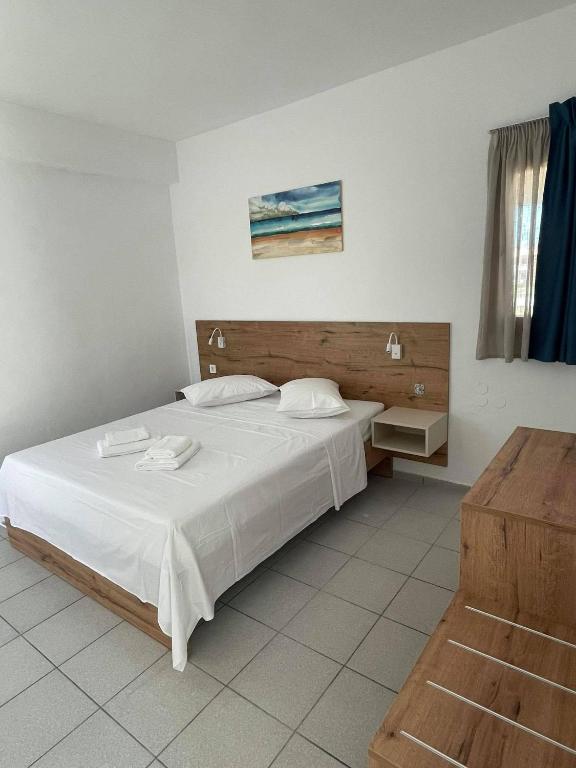 Postel nebo postele na pokoji v ubytování Coralli Beach Hotel