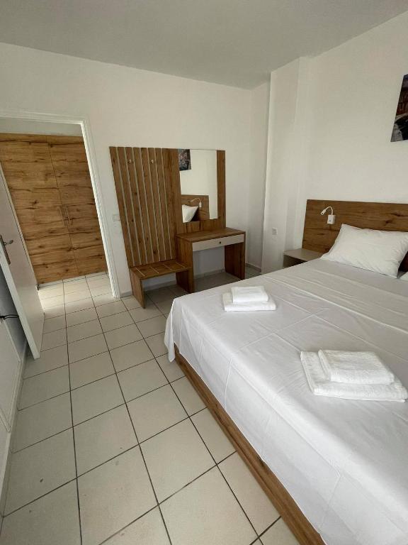 Postel nebo postele na pokoji v ubytování Coralli Beach Hotel