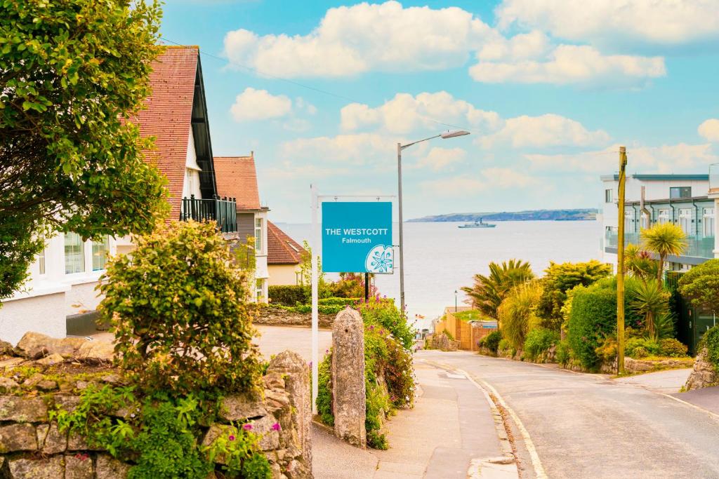 a street with a blue sign on the side of a road at The Westcott by the Sea - Just for Adults in Falmouth