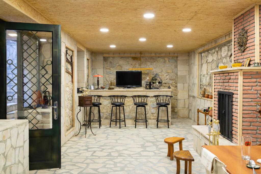 TV a/nebo společenská místnost v ubytování Hotel BANI