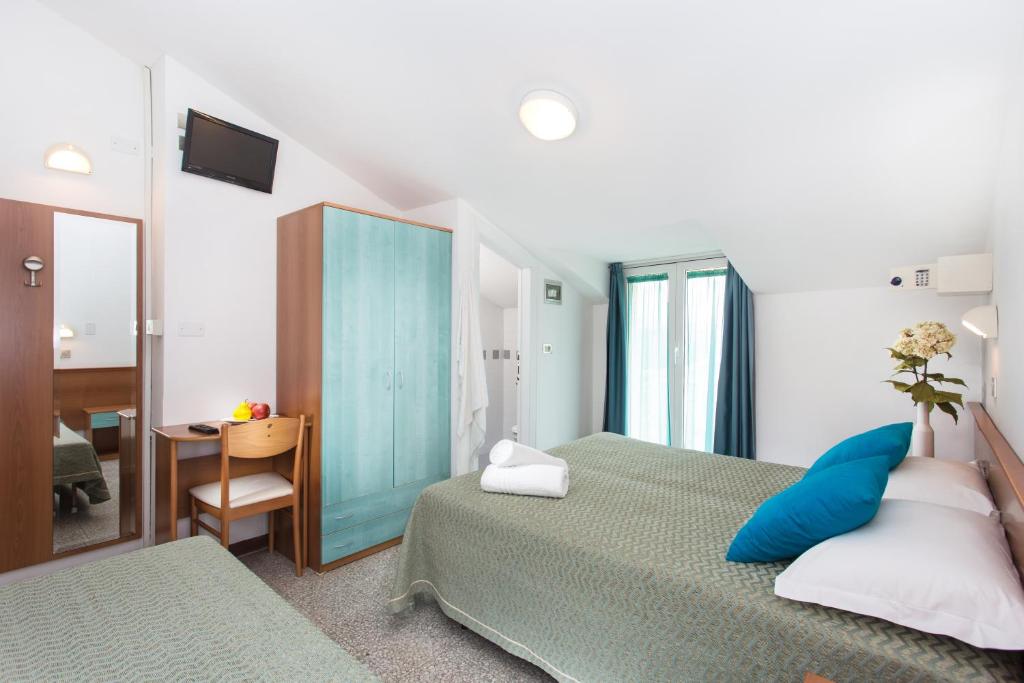 Postel nebo postele na pokoji v ubytování Hotel Gaia