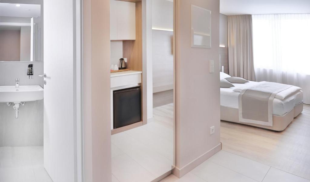 Postel nebo postele na pokoji v ubytování Ocak Aparthotel
