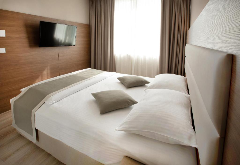 Postel nebo postele na pokoji v ubytování Ocak Aparthotel
