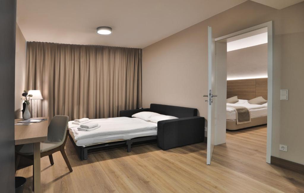 Postel nebo postele na pokoji v ubytování Ocak Aparthotel