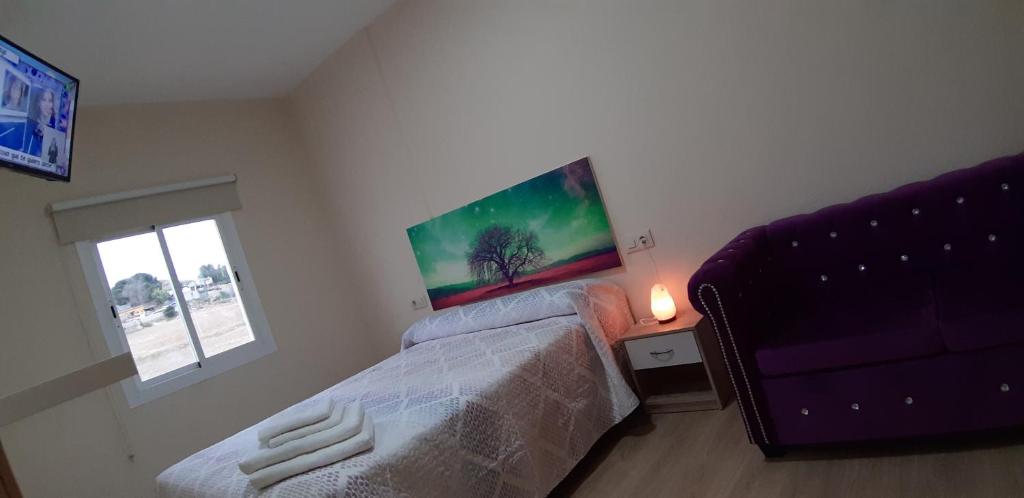 A bed or beds in a room at Piso La Buganvilla