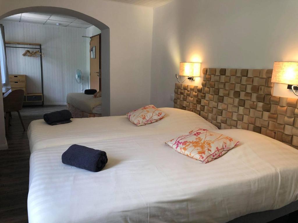 Postel nebo postele na pokoji v ubytování Hotel du Levant