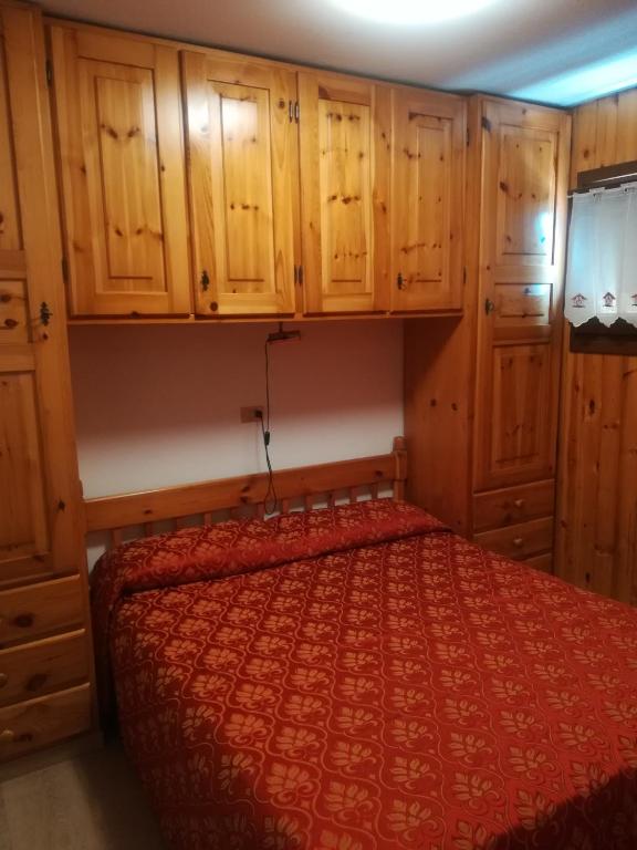 Postel nebo postele na pokoji v ubytování Appartamenti Abetaia