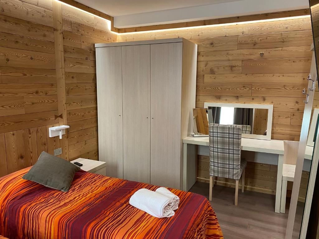 Posteľ alebo postele v izbe v ubytovaní Sottosopra Alps Apartments & Rooms