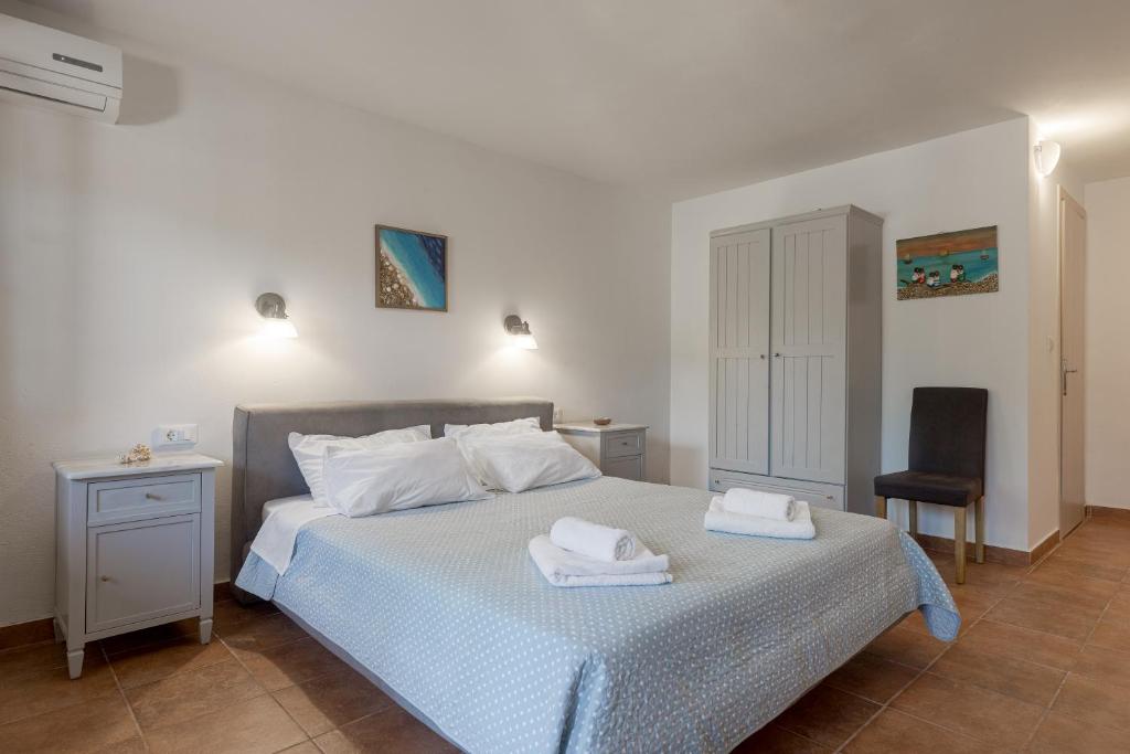 Postel nebo postele na pokoji v ubytování Tierra Olivo Villas