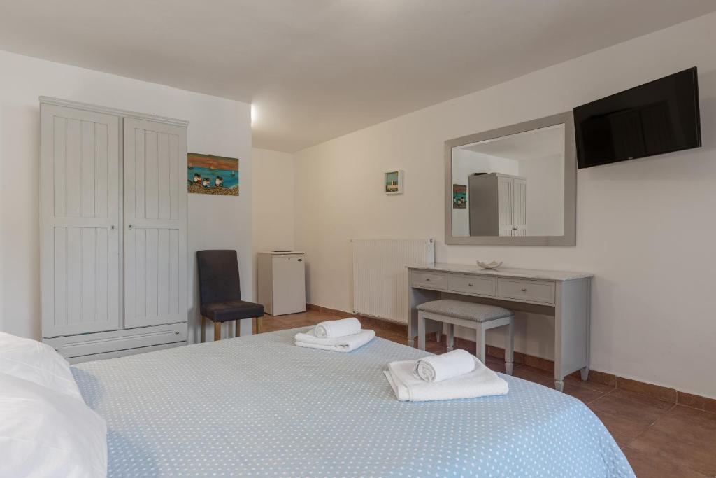 Postel nebo postele na pokoji v ubytování Tierra Olivo Villas