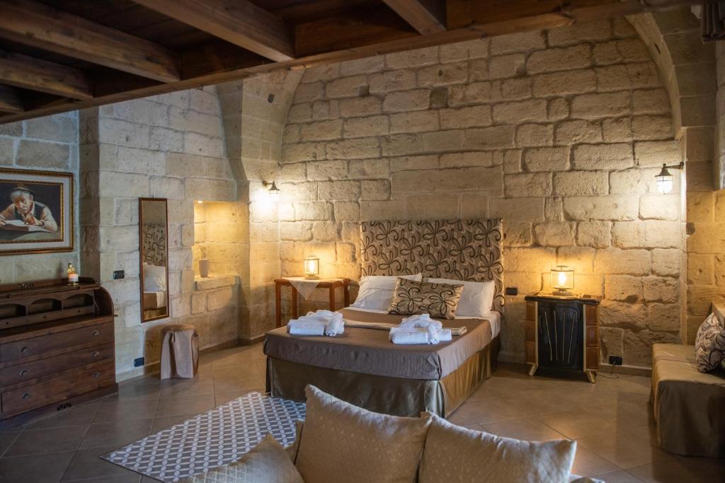 Łóżko lub łóżka w pokoju w obiekcie Masseria Giamarra