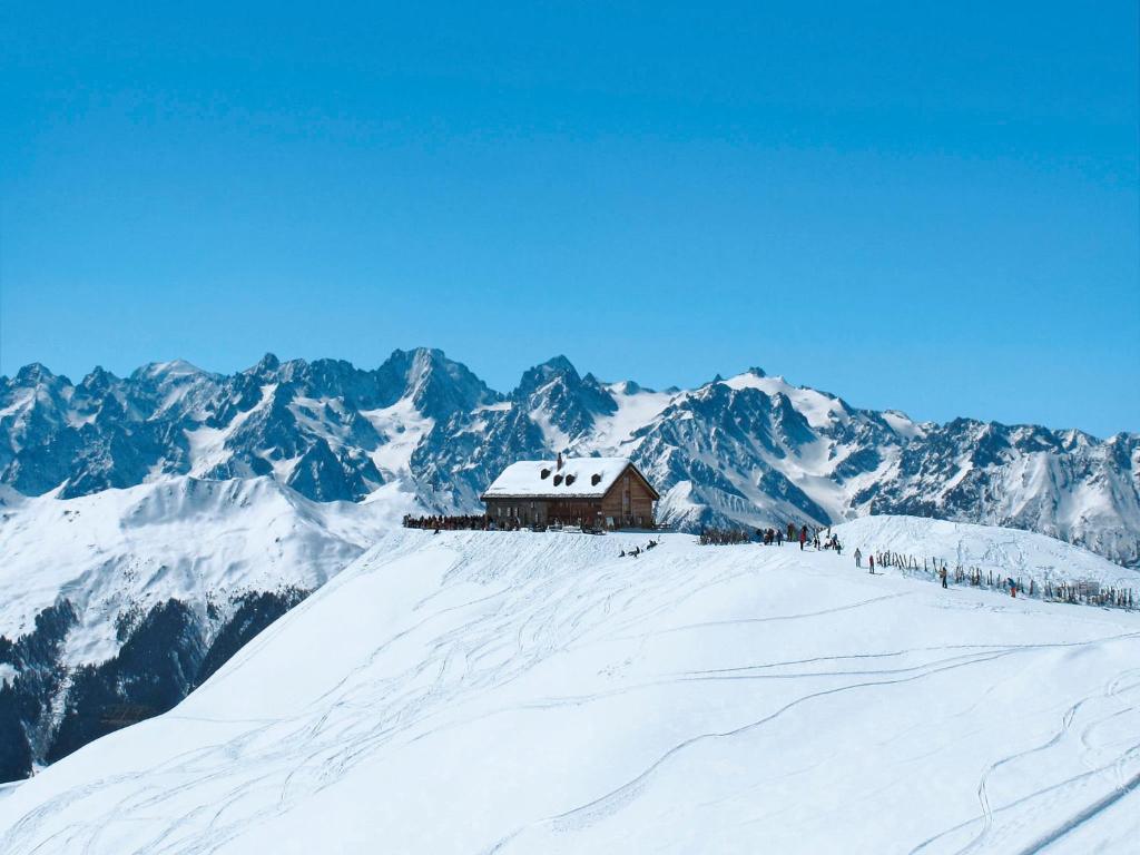 a ski lodge on top of a snow covered mountain at Apartment Hameau D01 by Interhome in Les Collons