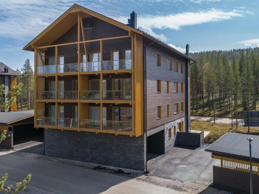 a house with a lot of windows on it at Holiday Home Tunturinlaita c9- 2 skipasses included by Interhome in Sirkka