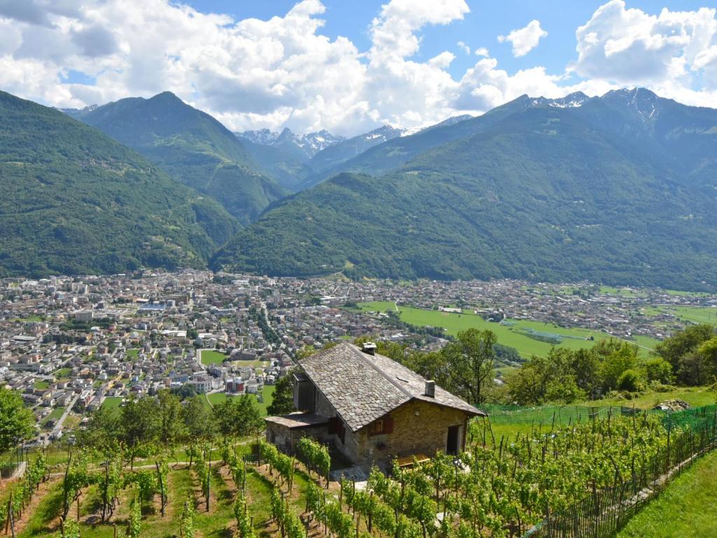 a village in a valley with mountains in the background at Chalet Rustico Rebustella by Interhome in Civo