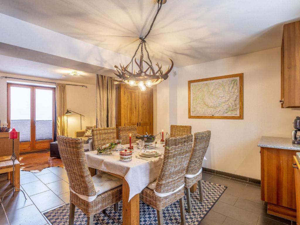 a dining room with a table and chairs at Apartment La Trace Blanche by Interhome in Villaroger