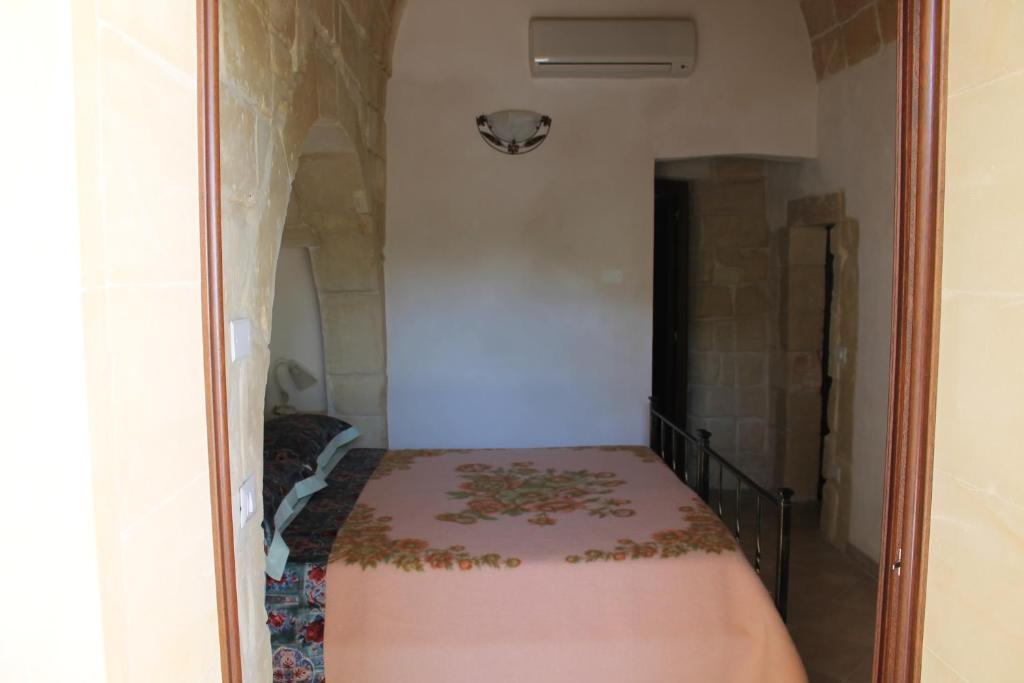 Postel nebo postele na pokoji v ubytování Masseria Cricelli
