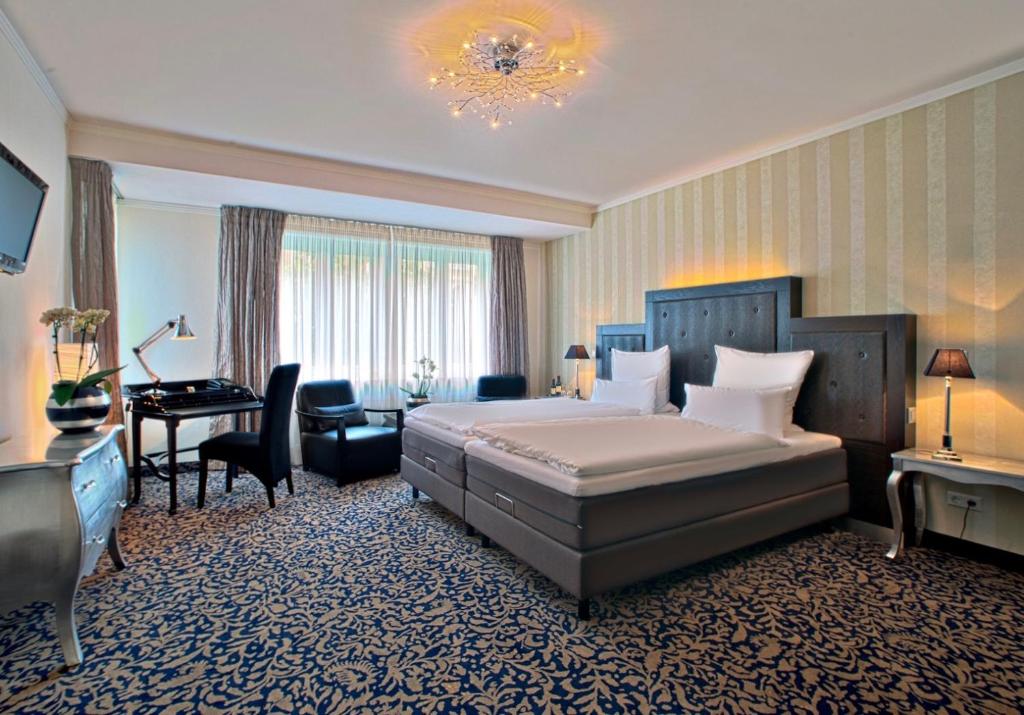 Кровать или кровати в номере Top Hotel Krämer