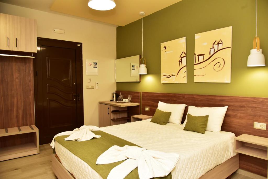 a bedroom with a large bed in a room at Lafo Rooms in Elafonisi
