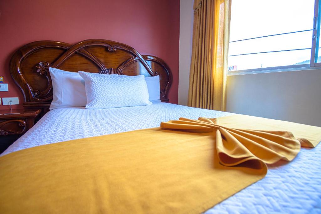 Postel nebo postele na pokoji v ubytování Hotel Cumbayá Sanvy