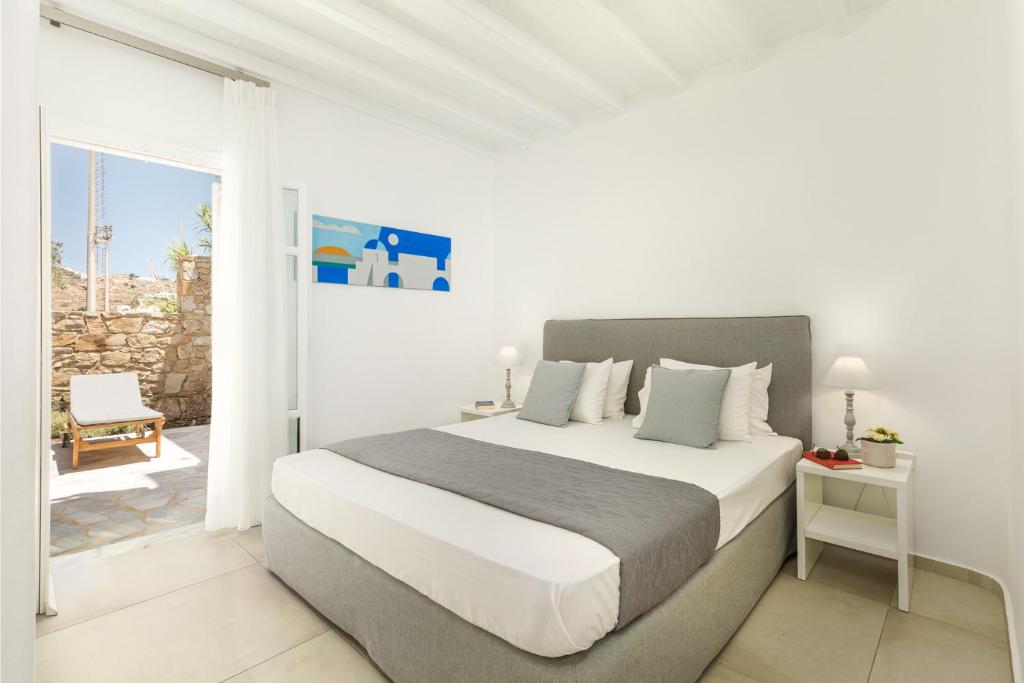 Postel nebo postele na pokoji v ubytování Corfos Hotel