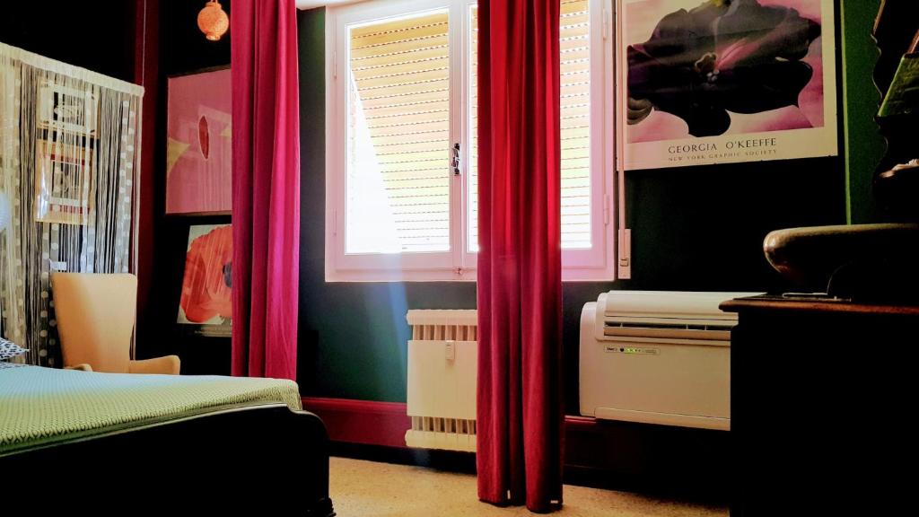 A bed or beds in a room at Domus LouLou