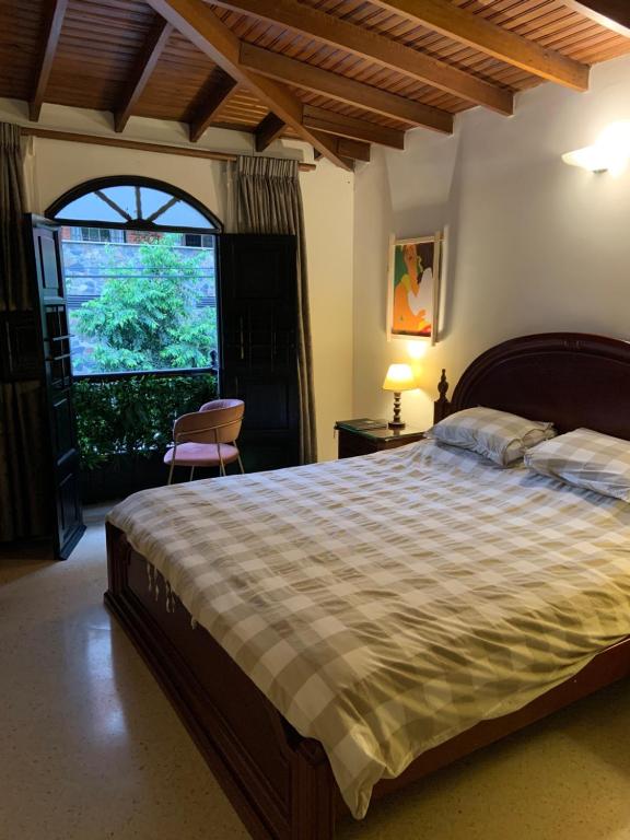 Postel nebo postele na pokoji v ubytování Casa Rosales