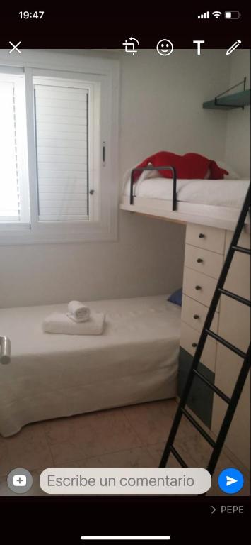 Postel nebo postele na pokoji v ubytování Sitges Aiguadolç playa